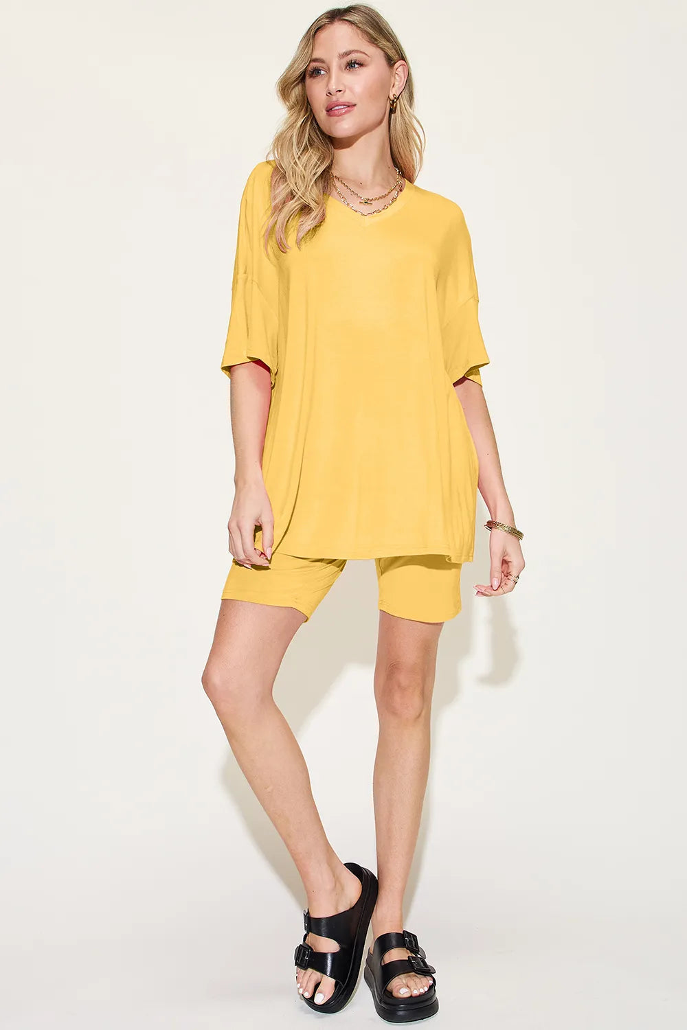 Basic Bae bamboo full-size V-neck drop shoulder T-shirt and shorts set by Trendsi, shown in beige with relaxed fit and casual style.