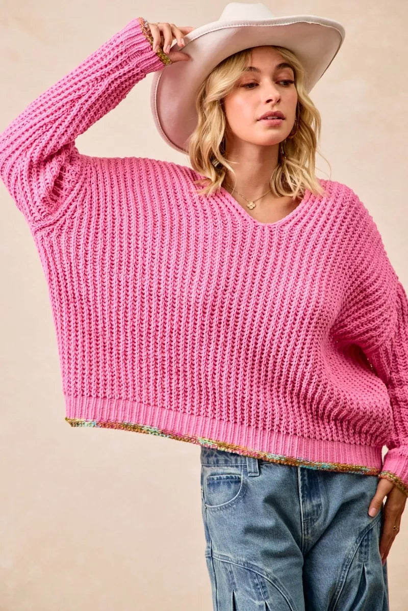 BiBi V-Neck Sweater by Trendsi featuring colorful trim and a soft knit fabric, shown on a model.