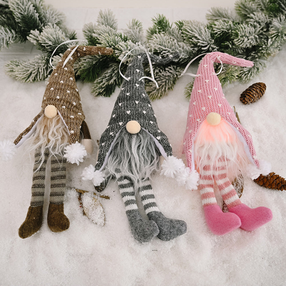 Faceless gnome figurine with long legs and light-up feature, perfect as a whimsical home decor piece.