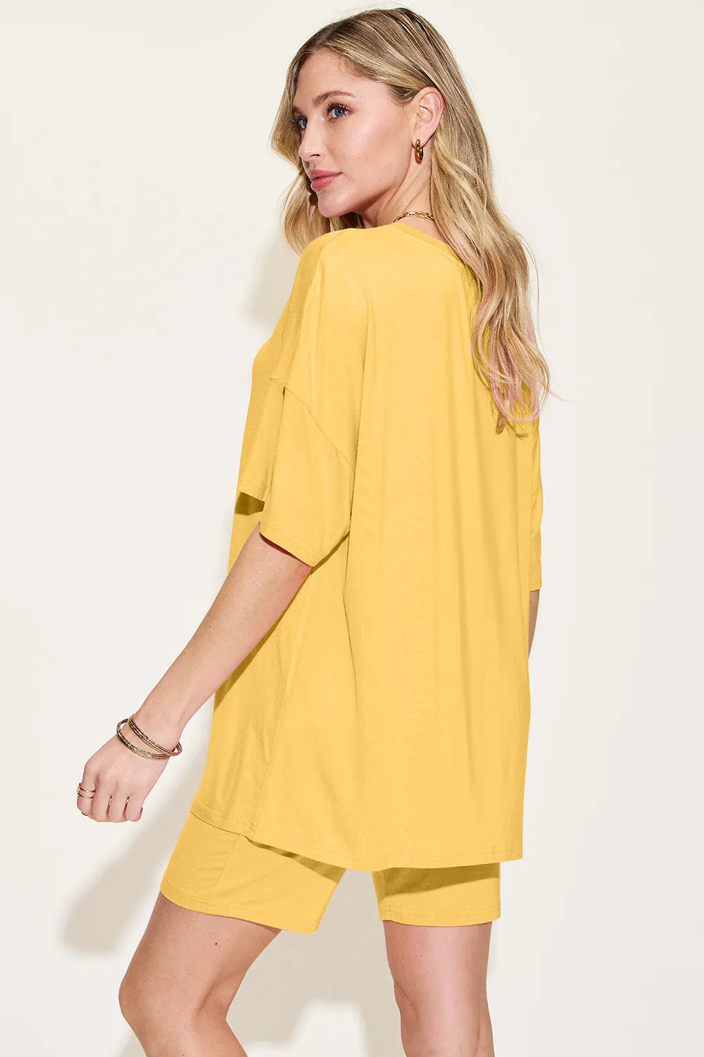 Basic Bae Bamboo full-size V-neck drop shoulder T-shirt and shorts set by Trendsi, featuring a comfortable, casual style in bamboo fabric.