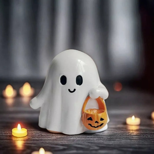 Halloween ghost ornament holding a pumpkin basket, decorative fall accessory from Trendsi with spooky, festive design.
