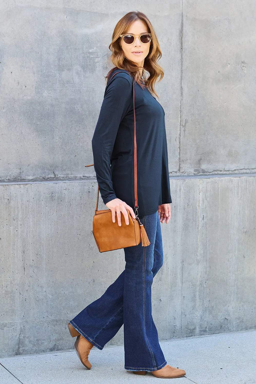 Long sleeve round neck top from Trendsi's Basic Bae collection, showcasing a classic fit and soft fabric in a neutral color.
