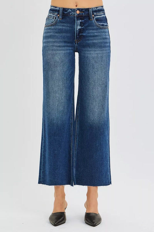 Plus size RISEN raw hem crop wide-leg jeans with mid-rise fit, styled by Trendsi, featuring distressed raw cut hems and classic denim look.