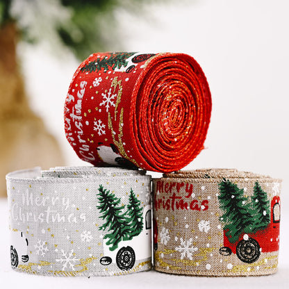 Decorative car and Christmas tree ribbon from Trendsi featuring red and green festive patterns on shiny satin material.