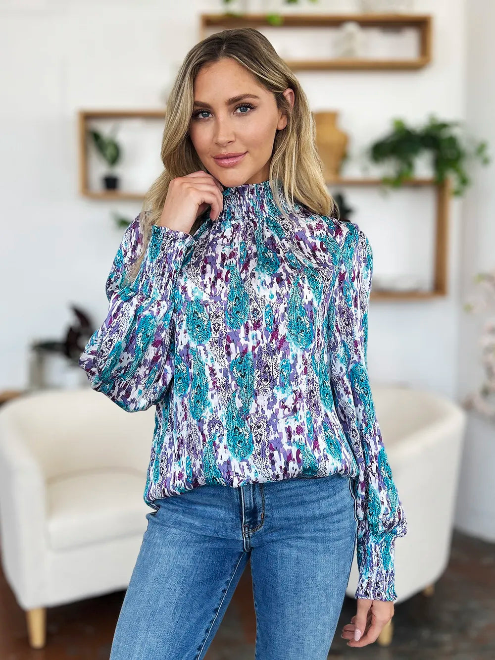 Printed smocked long sleeve blouse from Trendsi, featuring a full size, stylish design with a flattering fit and intricate pattern.