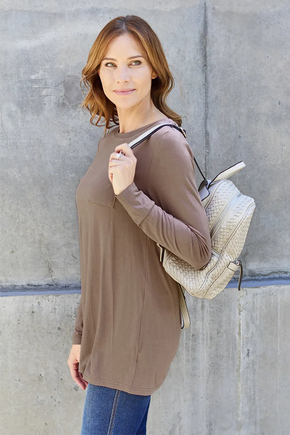 Basic Bae long sleeve round neck top by Trendsi, showing a close-up of the soft, fitted fabric in a neutral color.