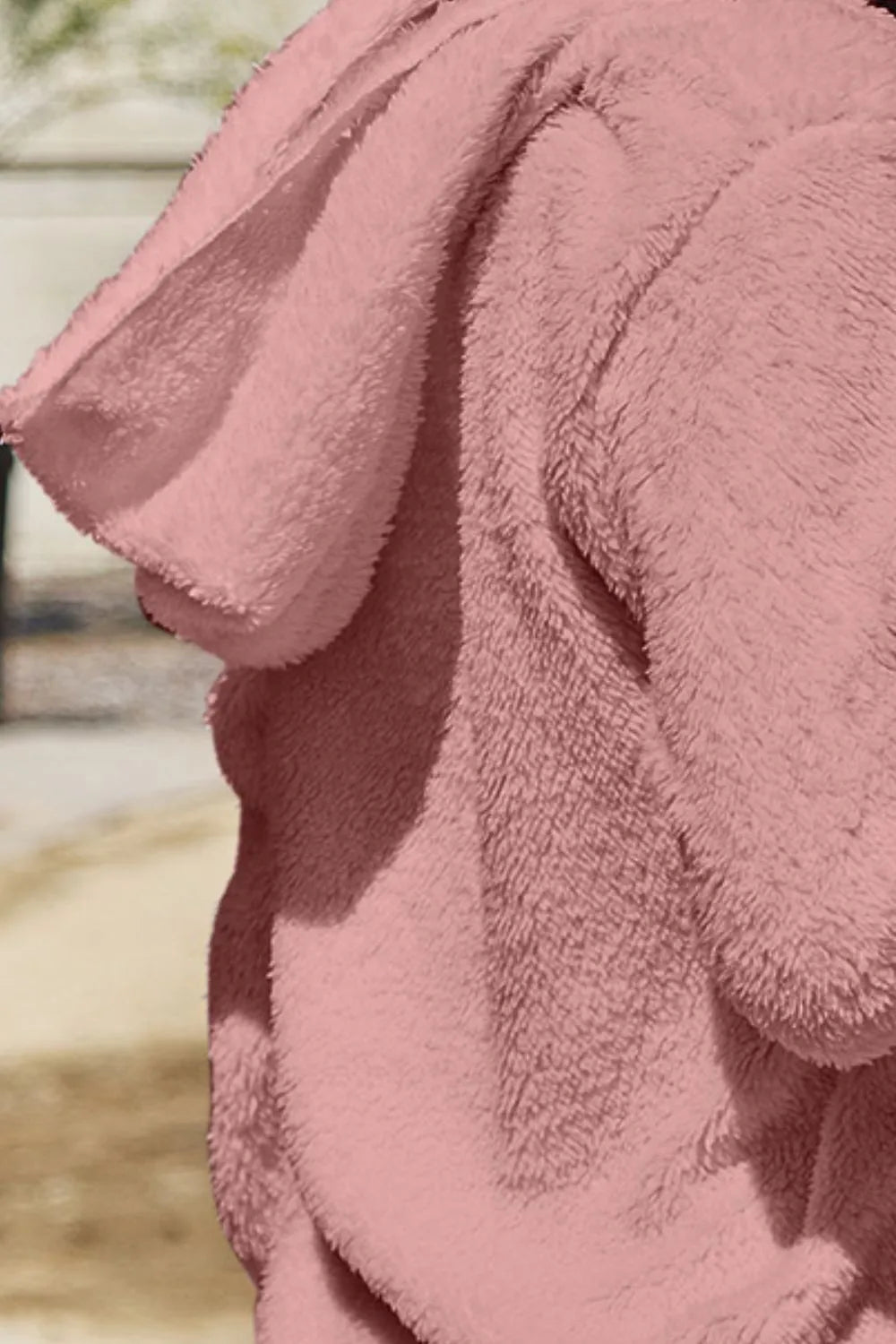 Full size teddy hooded jacket with front pockets, cozy and stylish, by Trendsi. Soft, plush fabric with a hood and practical pockets.