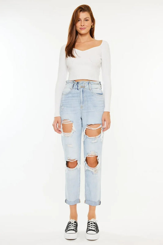 Light blue Kancan open pack paperbag mom jeans with high waist and relaxed fit, shown styled casually.