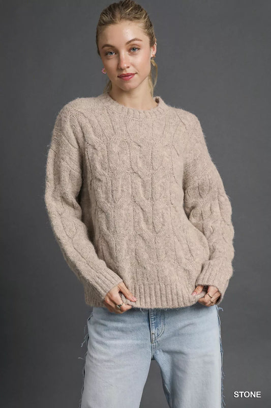 Trendy Umgee Cable Knit Cozy Sweater in neutral tones, featuring a chunky knit pattern and a relaxed fit.