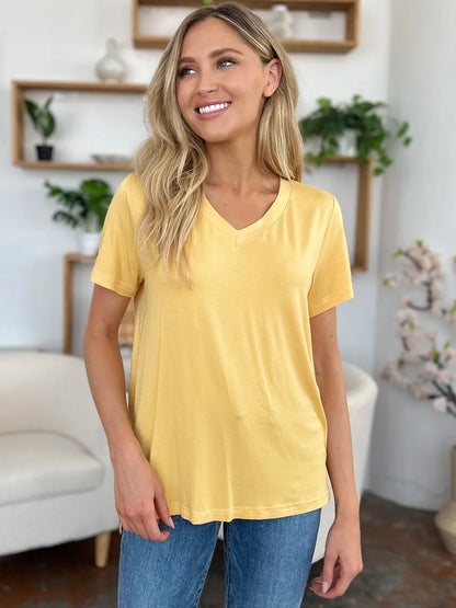 Basic Bae Bamboo V-Neck High-Low T-Shirt by Trendsi, full-size, soft bamboo fabric, front V-neck, and high-low hem detail.