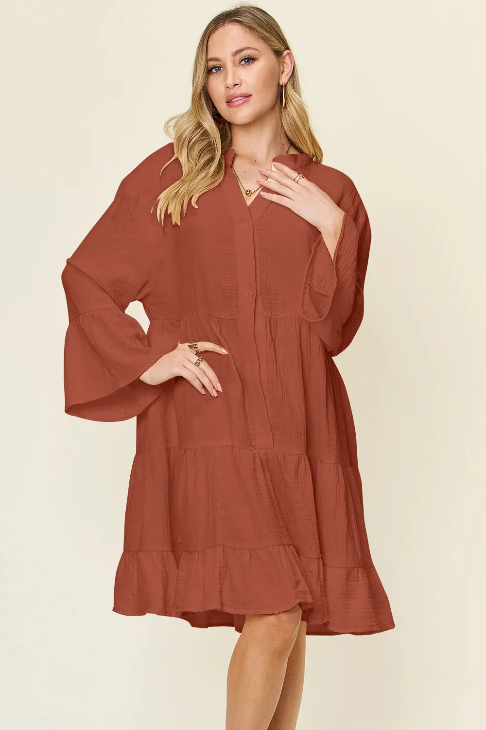 Plus size Double Take texture button-up dress with ruffle hem by Trendsi, featuring a full-length design and stylish fabric details.