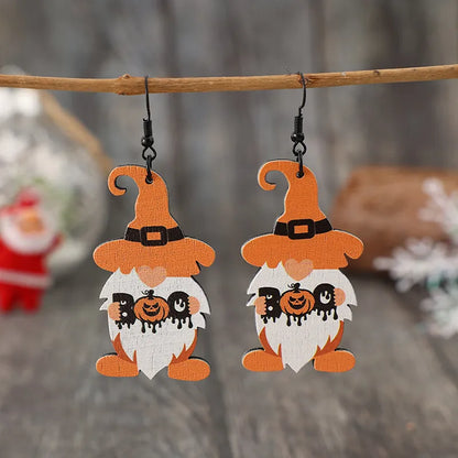 Wooden dwarf pumpkin dangle earrings with carved detailing, featuring a rustic design perfect for fall accessories.