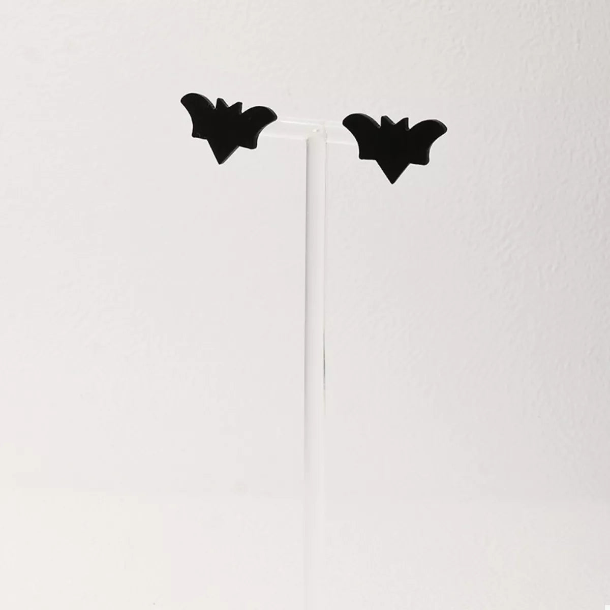 Halloween-themed stud earrings featuring spooky designs, perfect for festive accessories, by Trendsi.