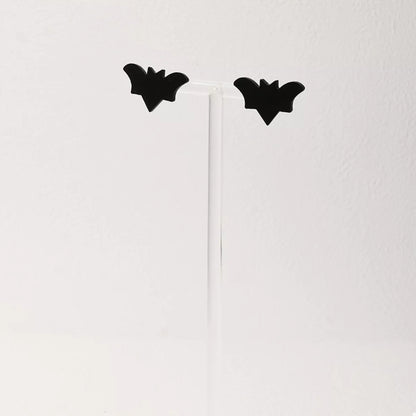 Halloween-themed stud earrings featuring spooky designs, perfect for festive accessories, by Trendsi.