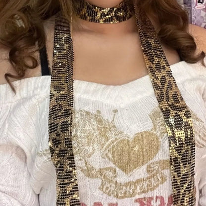 Shimmering sequin glamour scarf from Trendsi featuring a sparkling, stylish accessory with a soft fabric texture and elegant design.