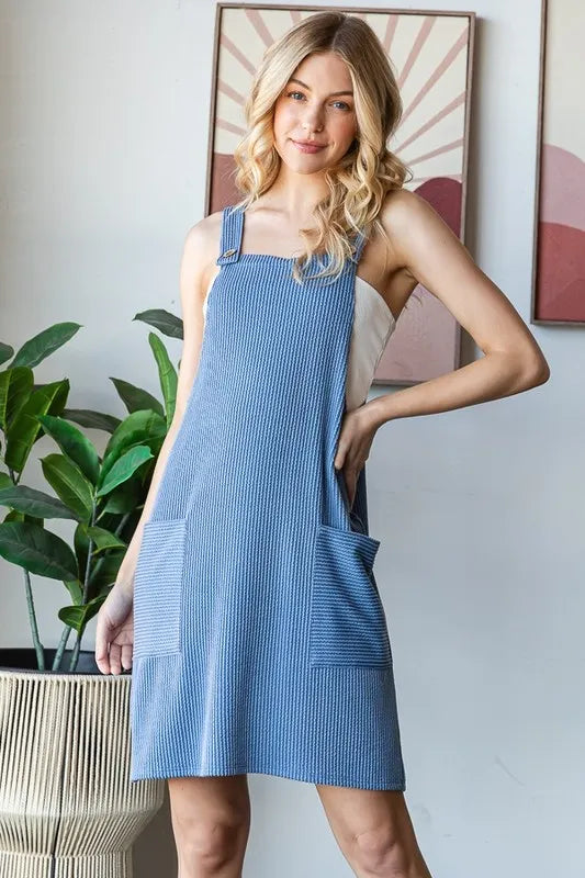 Heimish full size ribbed sleeveless mini tank dress in plus size, featuring a fitted silhouette and classic ribbed texture.