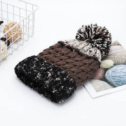 Contrast thermal hat with pompom from Trendsi featuring a cozy knit design and a playful pompom on top.