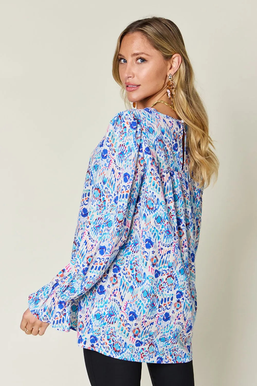 Printed flounce sleeve blouse from Trendsi, featuring a double take full size design with ruffled, feminine sleeve details.