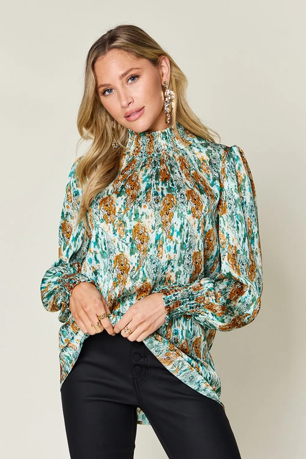 Printed smocked long sleeve blouse by Trendsi featuring a double take design and full size fit with stylish details.