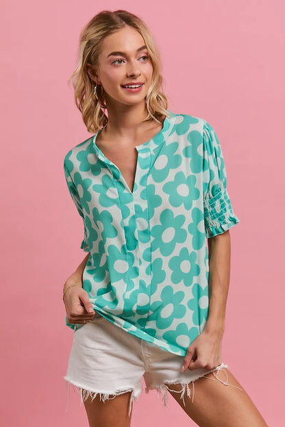 BiBi Flower printed woven smocking sleeve V-neck top by Trendsi featuring floral design, lightweight fabric, and relaxed fit.