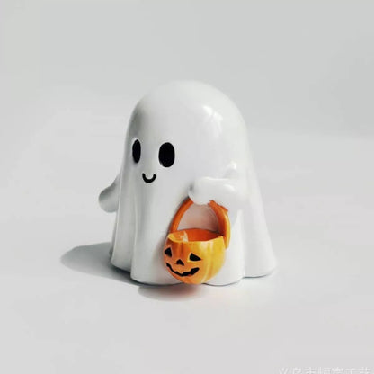 Halloween ghost ornament holding a pumpkin basket, decorative Trendsi Halloween ghost figurine for festive fall decor.