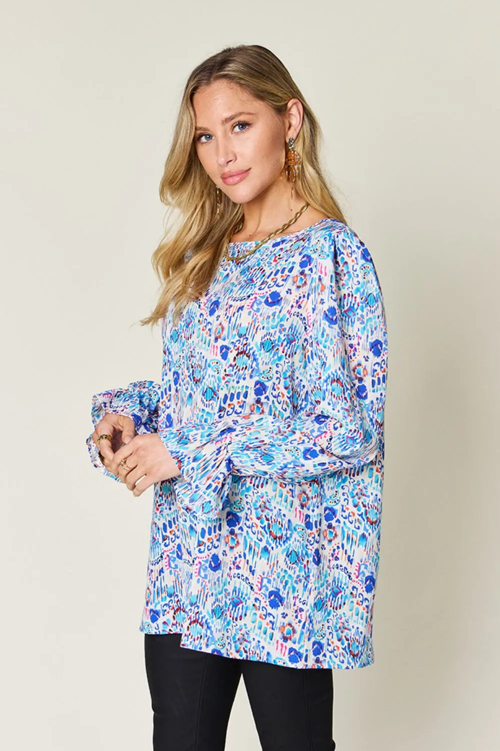 Printed flounce sleeve blouse by Trendsi featuring a double take full size design with stylish flared sleeves.