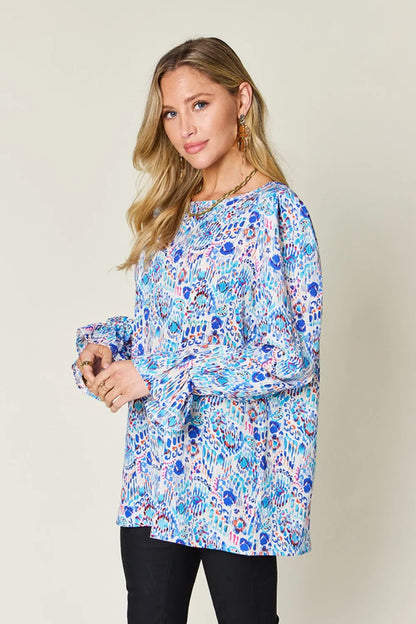 Printed flounce sleeve blouse by Trendsi featuring a double take full size design with stylish flared sleeves.