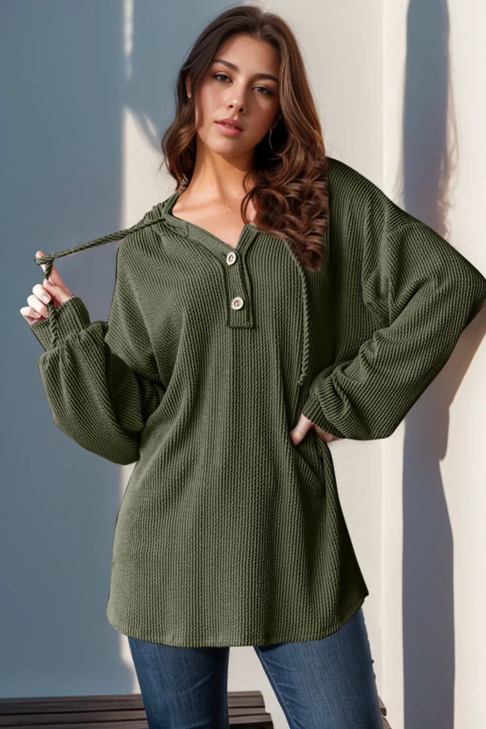 Long sleeve hoodie by Trendsi featuring a half-button front, full size, and casual style with a relaxed fit.