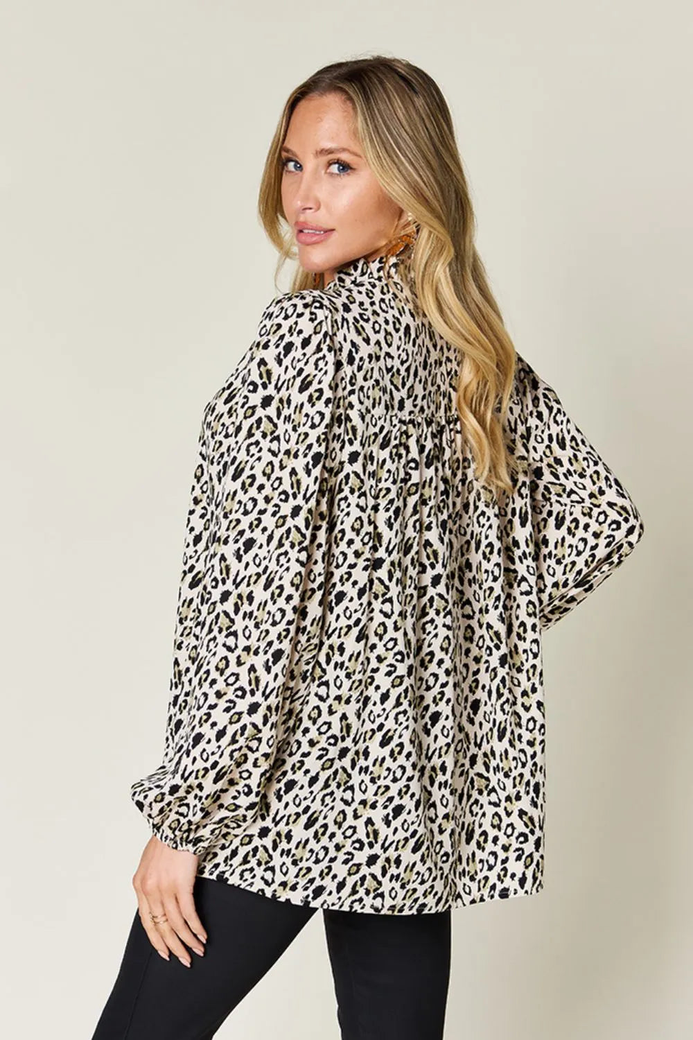 Plus size leopard print long sleeve blouse by Trendsi, featuring a stylish double take full size design and comfortable fit.