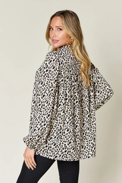 Plus size leopard print long sleeve blouse by Trendsi, featuring a stylish double take full size design and comfortable fit.