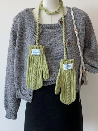 Cable knitted mittens with neck strap from Trendsi, featuring a cozy, textured knit design and a secure strap for warmth and style.