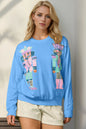 Trendsi Double Take full-size sequin Nutcracker long sleeve sweater featuring festive holiday design and sequin accents.