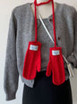 Cable knitted mittens with neck strap from Trendsi, featuring cozy cable knit pattern and adjustable strap for a stylish winter look.