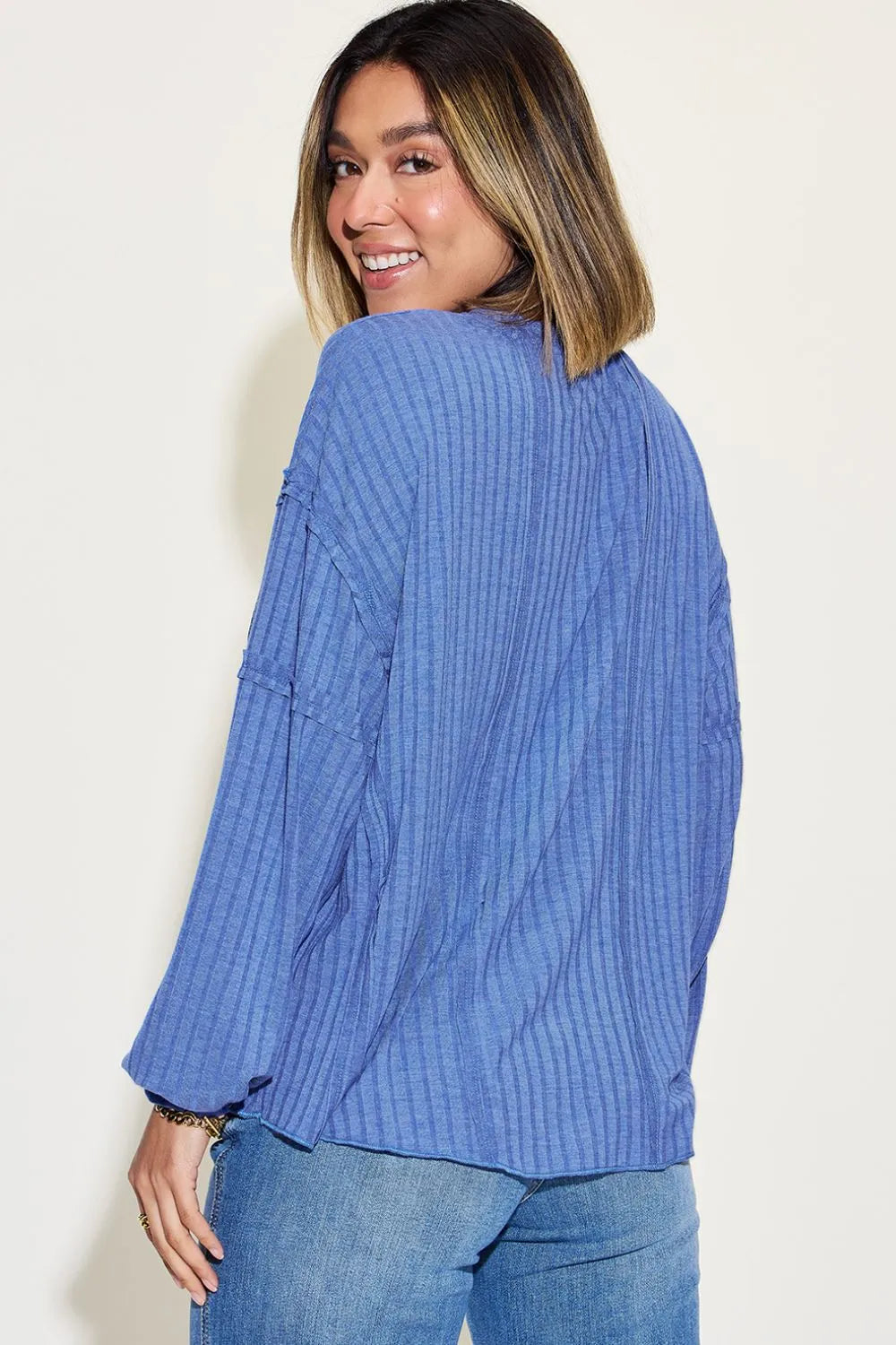 Ribbed round neck long sleeve T-shirt by Trendsi in basic Bae full size, featuring a fitted design and soft fabric in neutral color.