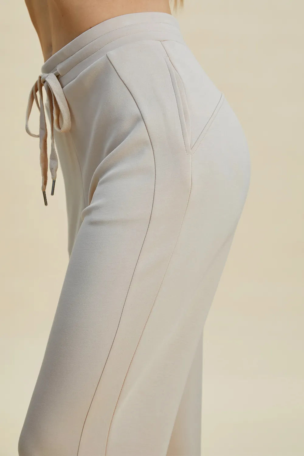 Trendsi Basic Bae full-size air scuba drawstring high waist cropped pants in black, featuring a relaxed fit and elastic waistband.