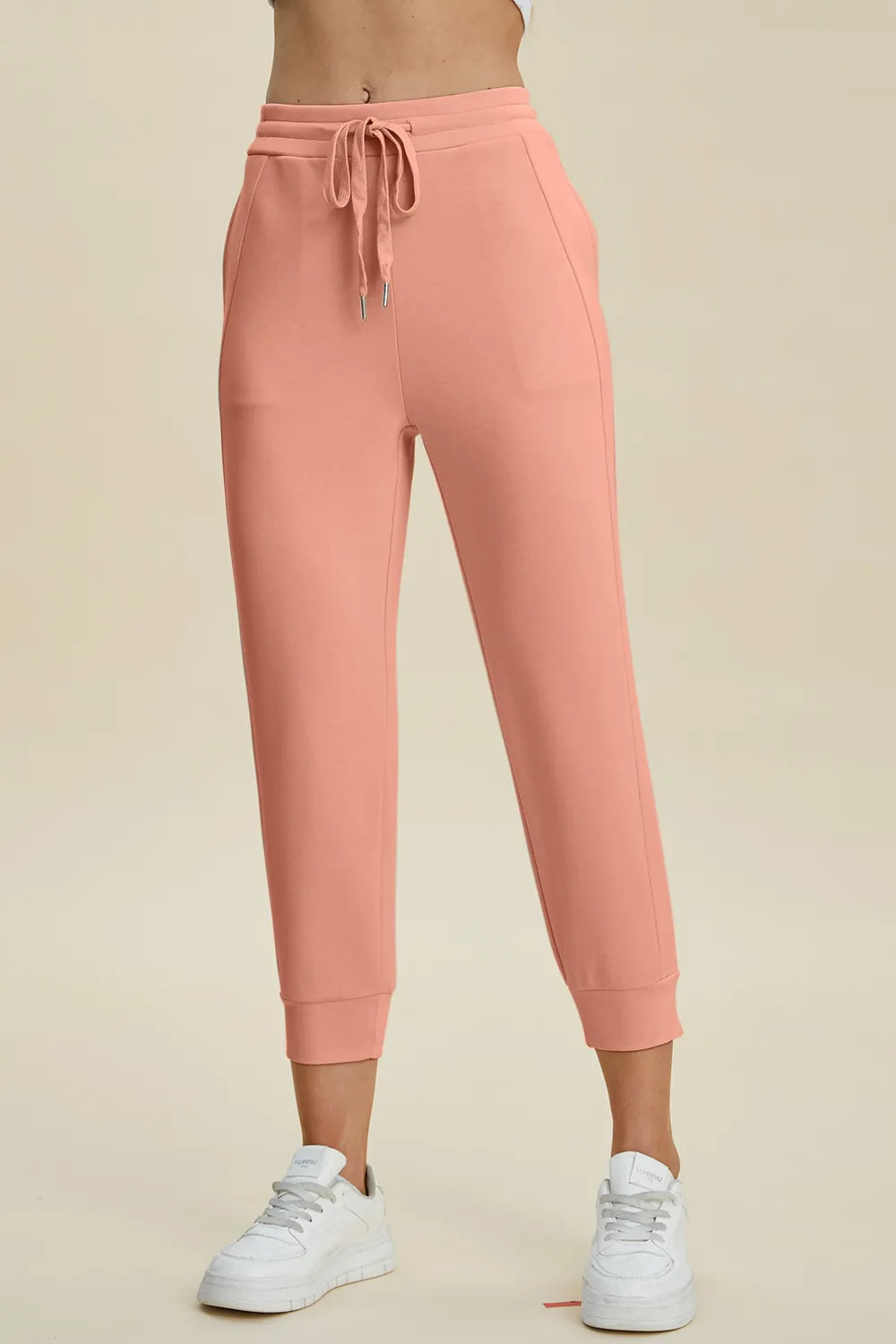 High-waist cropped scuba pants by Trendsi, featuring a drawstring waistband and full-size fit in a basic Bae style.