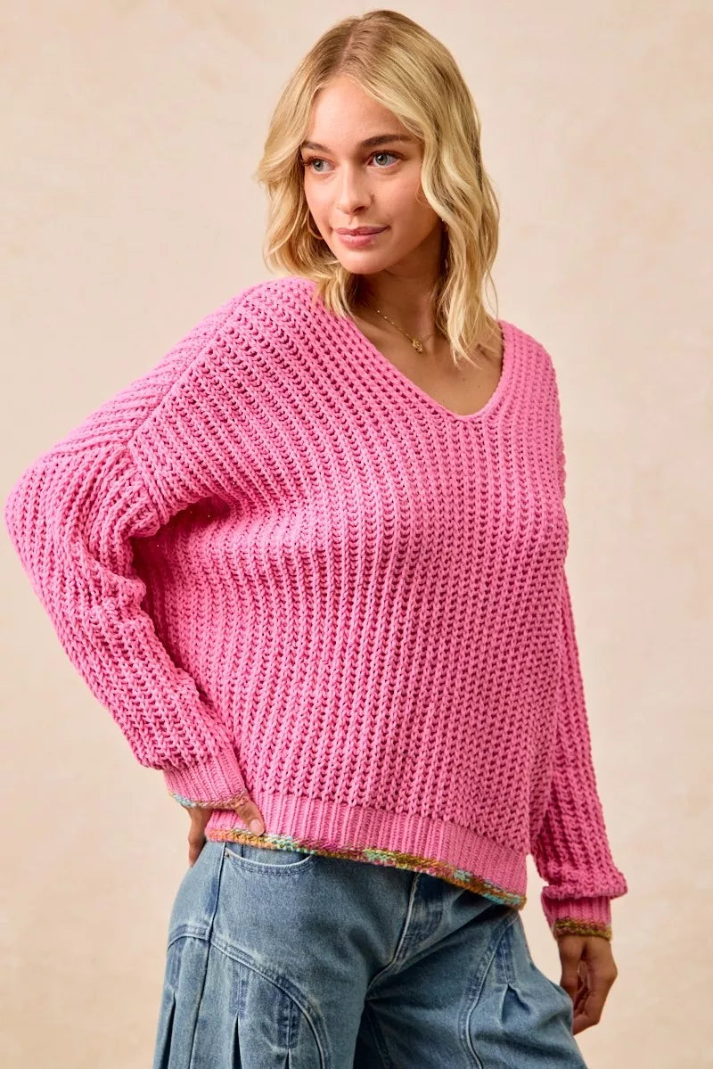 Trendsi BiBi V-neck sweater with colorful trim, soft knit fabric, and long sleeves, shown in a close-up of the stylish neckline.