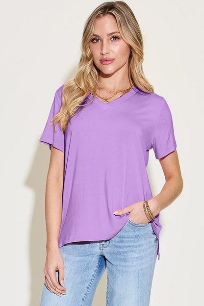 Basic Bae Bamboo full-size V-neck high-low T-shirt by Trendsi, shown in a natural fit with bamboo fabric and V-neck style.
