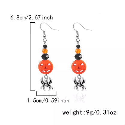 Halloween spider and pumpkin drop earrings featuring a spooky design, perfect for festive accessories and Halloween costumes.