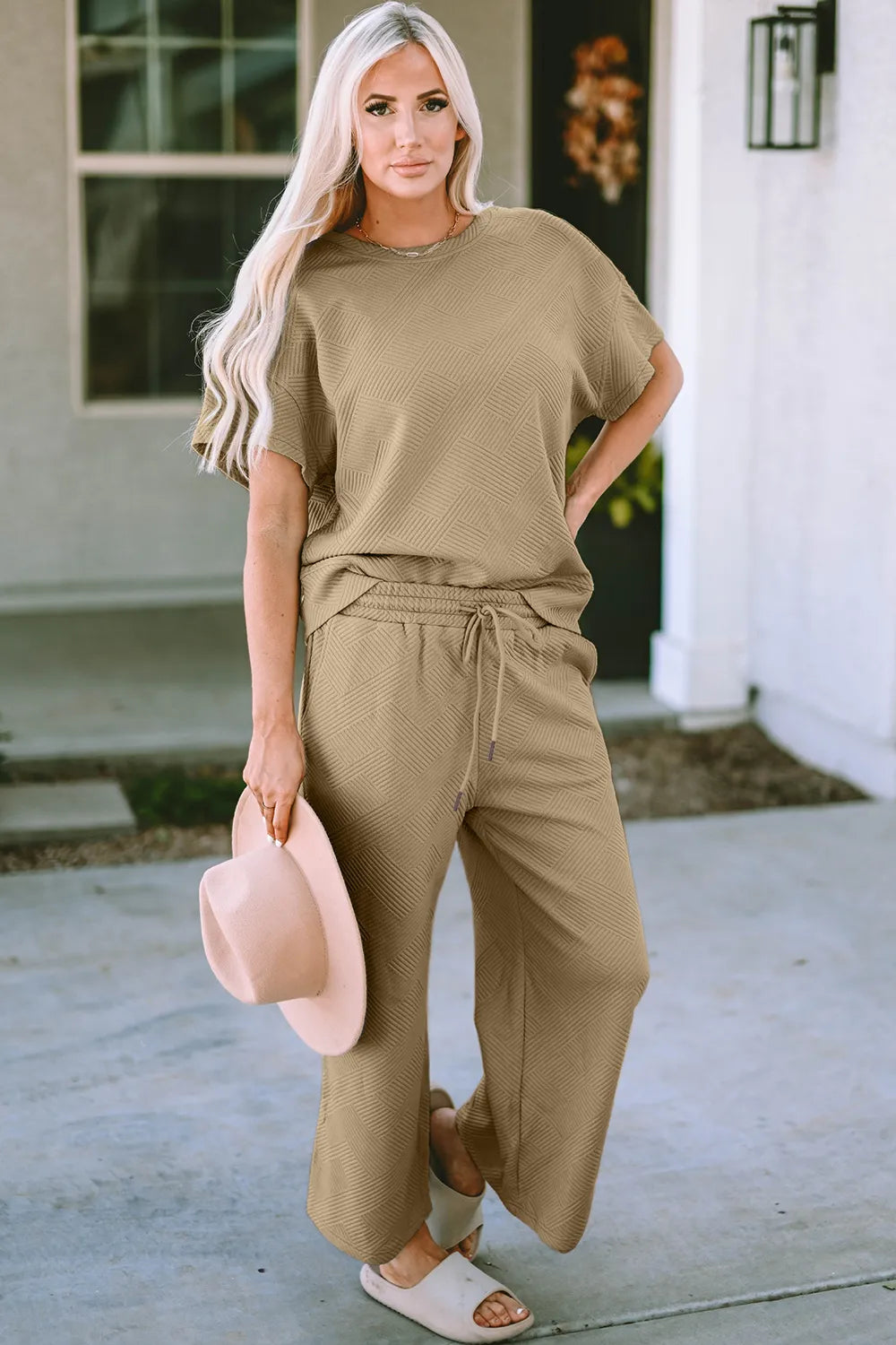 Trendsi double take full size textured short sleeve top and matching pants set with a relaxed fit and stylish design.