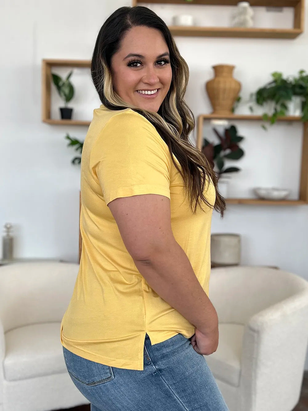 Basic Bae Bamboo full size V-neck high-low T-shirt by Trendsi, showing the soft bamboo fabric and stylish V-neck design.