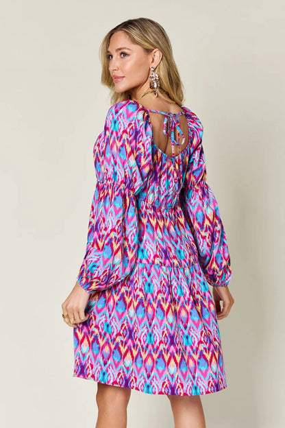 Long sleeve printed dress from Trendsi's Double Take collection, full size, featuring vibrant pattern and comfortable fit.
