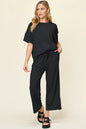 Trendsi double take full size texture round neck short sleeve T-shirt with wide-leg pants, casual outfit, front view, neutral background