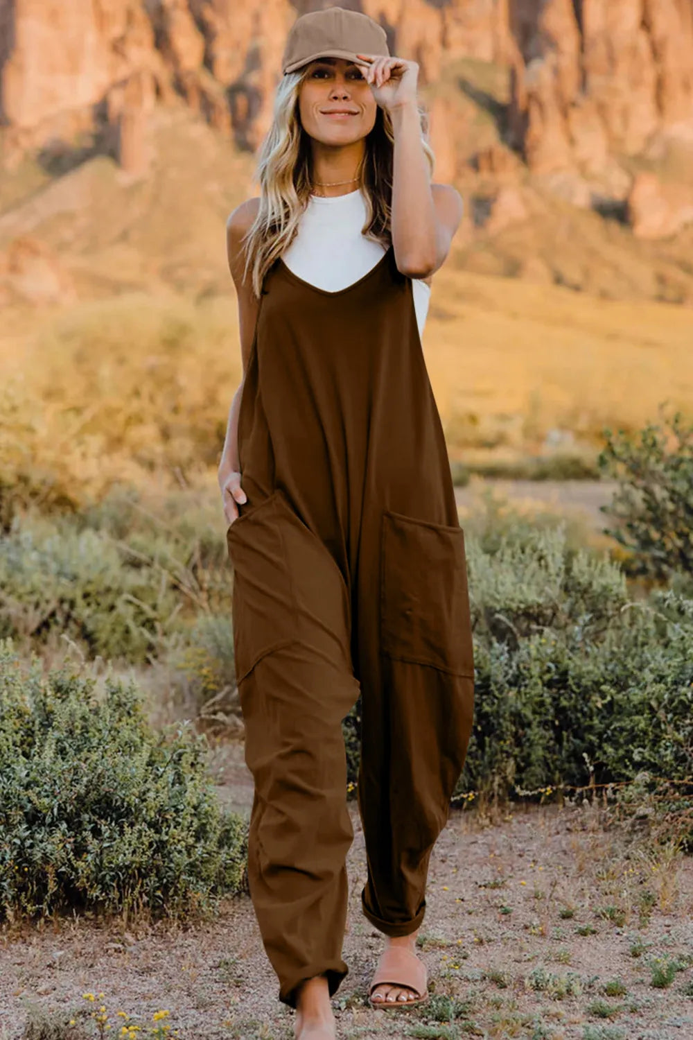 Full-length image of a Trendsi double take V-neck sleeveless jumpsuit with pockets, showcasing its stylish fit and comfortable design.
