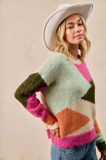 Multicolor block sweater top by Trendsi featuring a cozy design with vibrant color blocks and long sleeves.