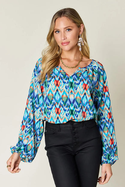 Printed balloon sleeve blouse with double take full size design, featuring trendy balloon sleeves in a stylish pattern.