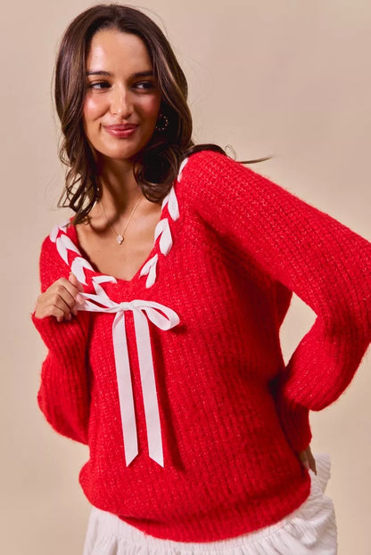 Trendsi SO ME Satin Tape Braided Ribbon Tie V Neck Sweater showing the front with satin ribbon tie and V neckline