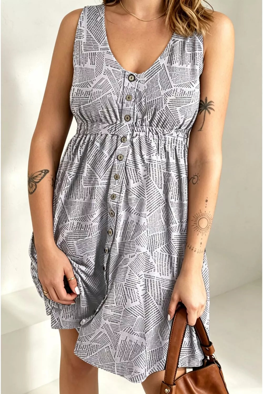Trendsi double take printed sleeveless casual dress with front buttons, ruched waist, side slit, and pockets, max.webp