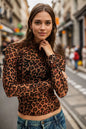 Oh Full Size Frill Printed Mock Neck Long Sleeve Top by Trendsi, featuring a stylish printed design and ruffled details on the sleeves.