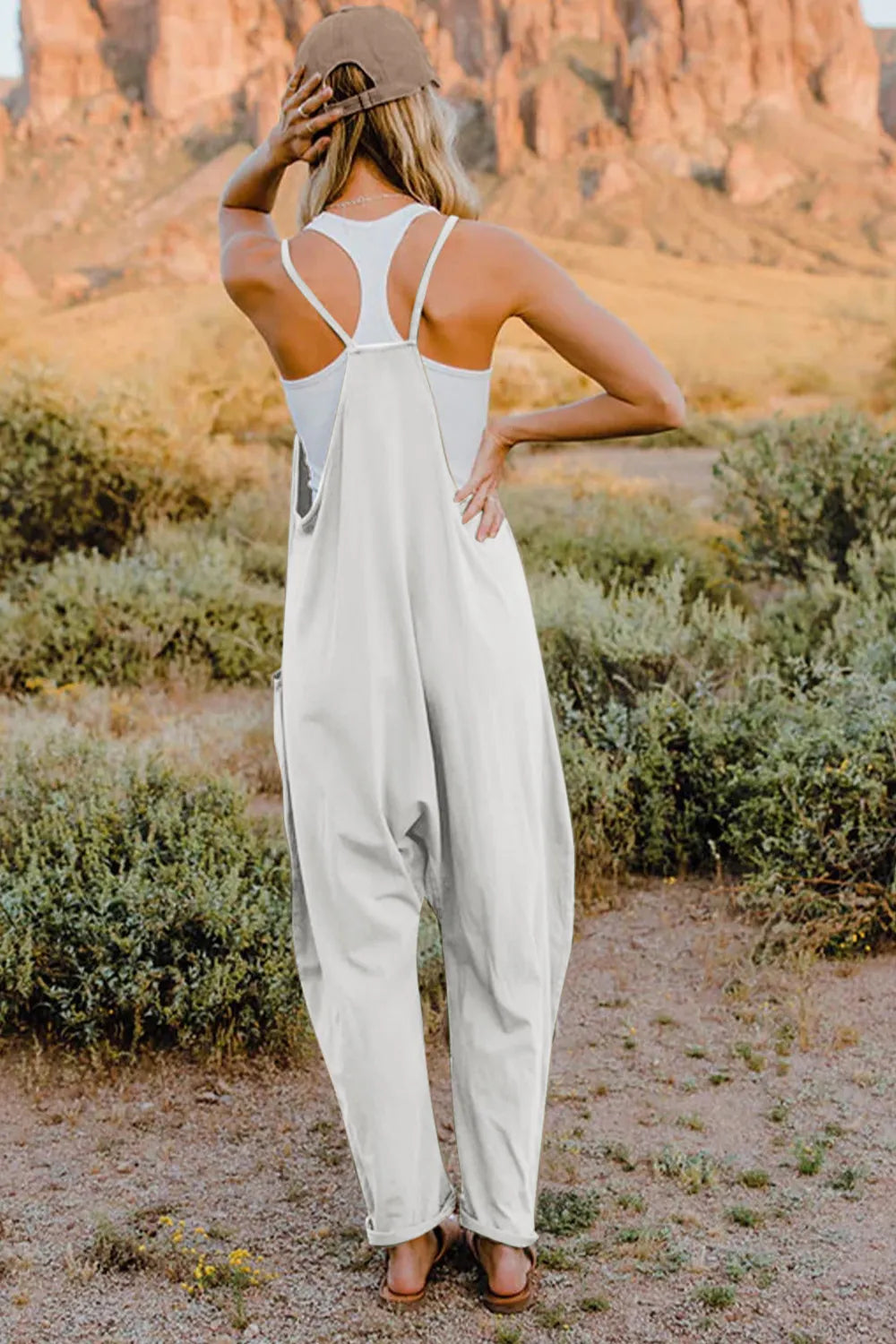 Trendsi Double Take full size sleeveless V-neck jumpsuit with pockets, stylish and comfortable summer jumpsuit on a model.